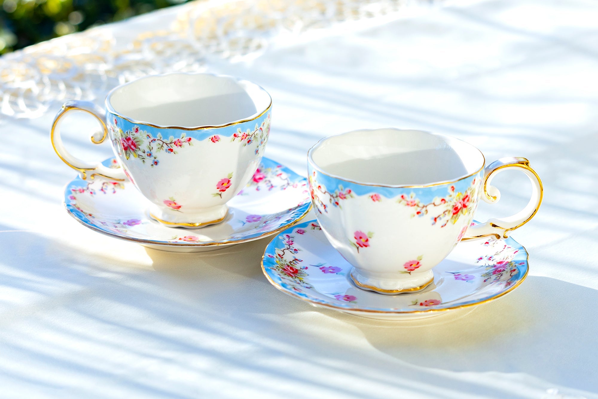 Rose with Blue Accent Fine Porcelain Tea Cup and Saucer